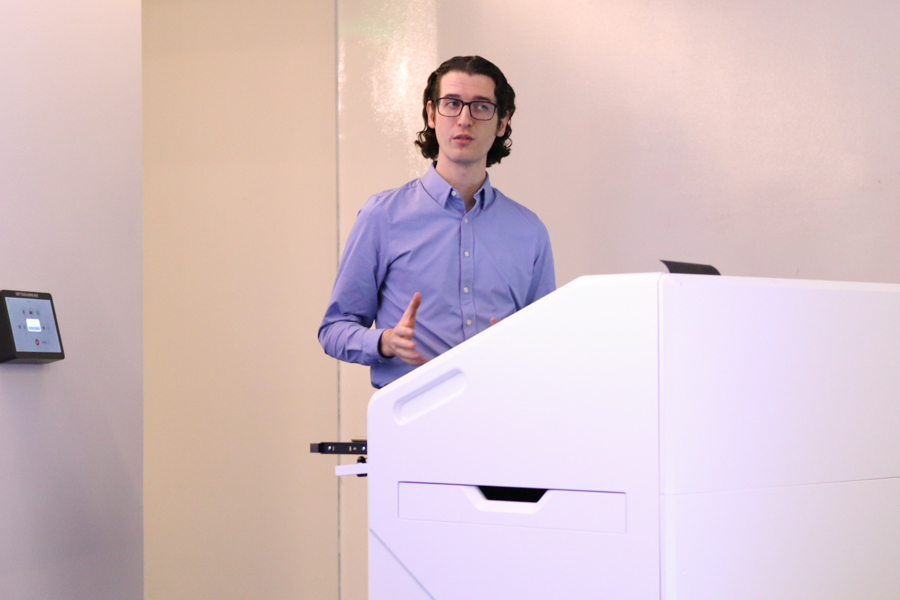 man speaks into microphone