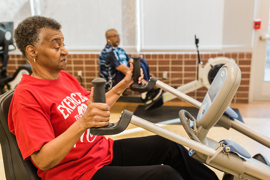 Engage Wellness members working out on exercise equipment.