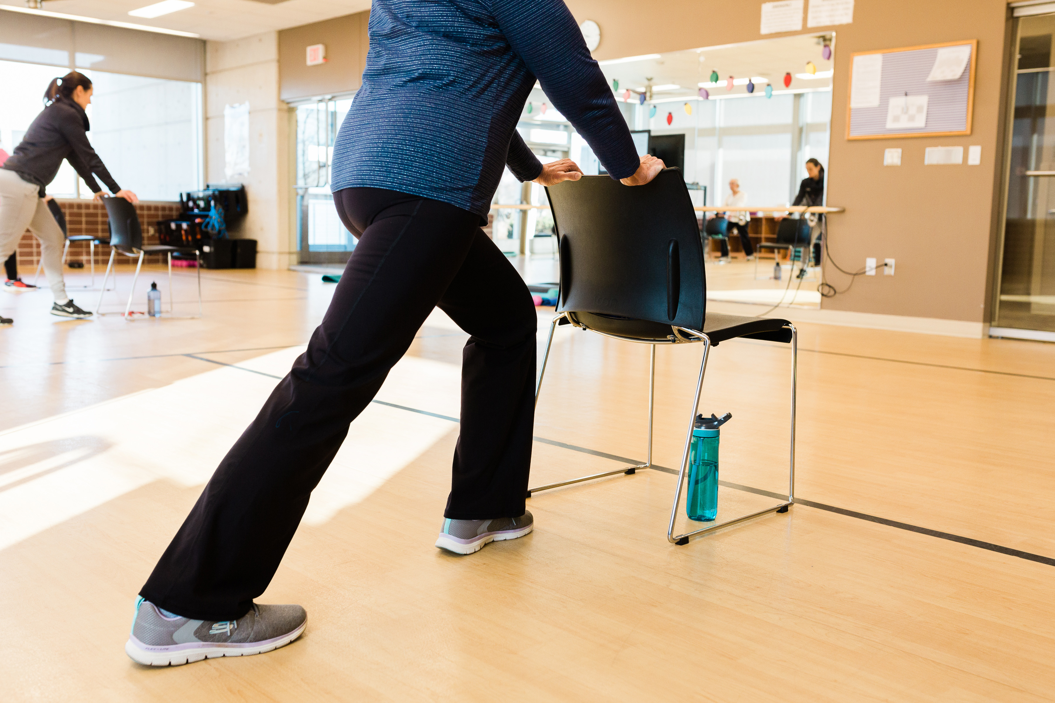 A participant takes part in an instructor-led group movement class at UNMC's Engage Wellness.