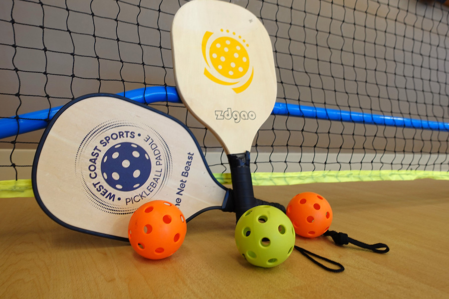 Pickleball paddles and balls are available for use at UNMC's Engage Wellness.