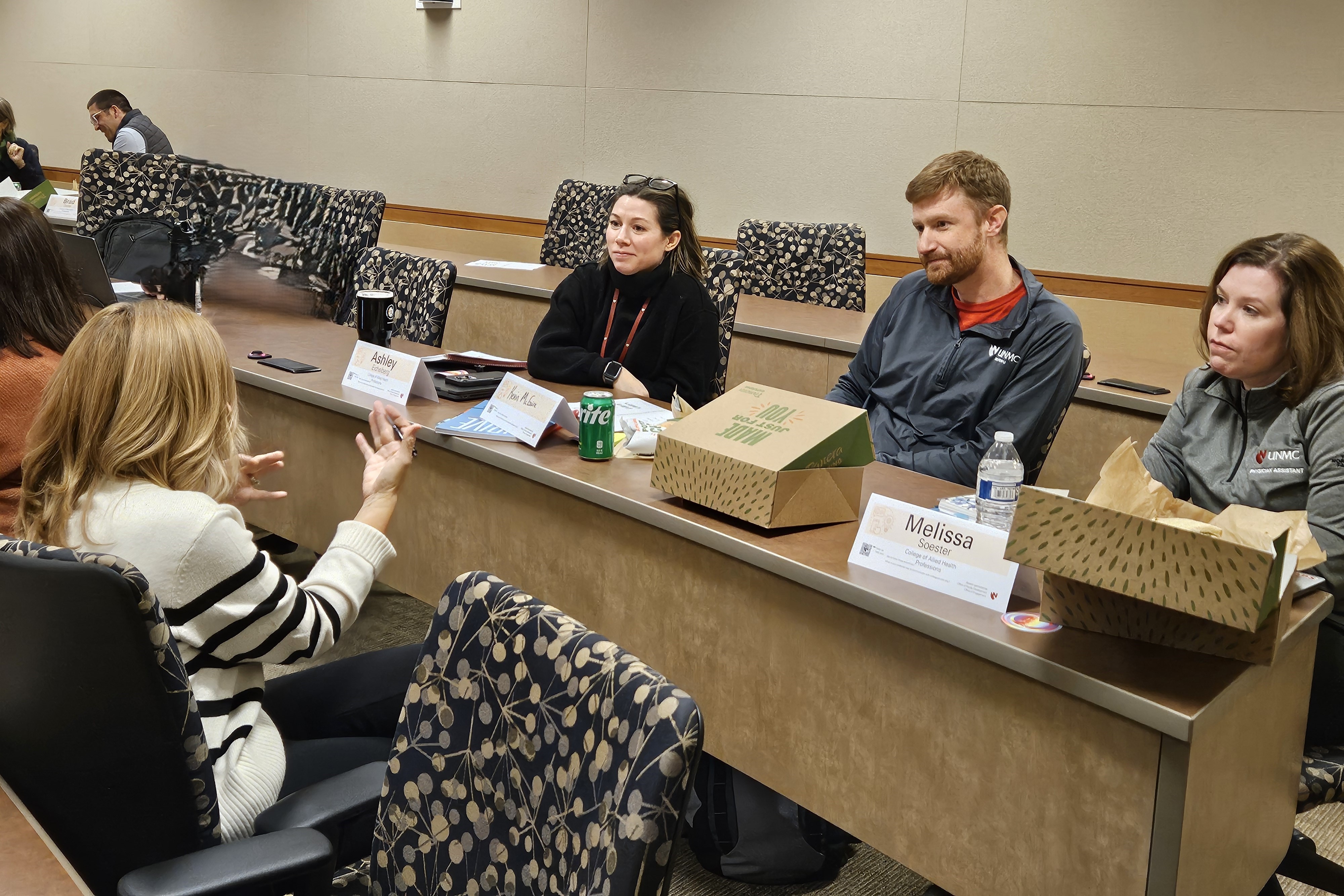 faculty group coaching around the table