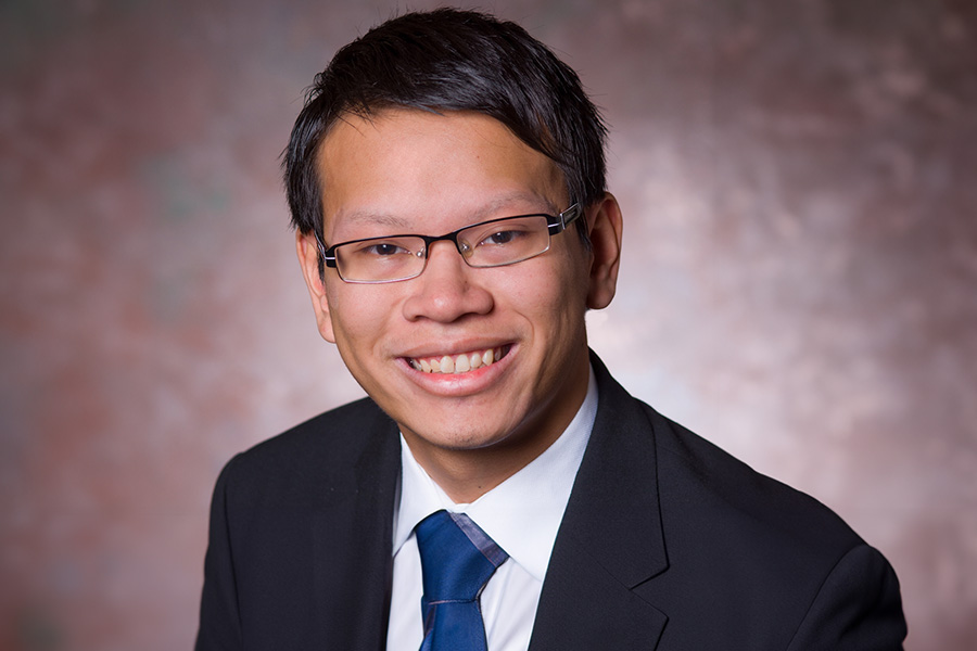 Andrew Pham poses for a headshot