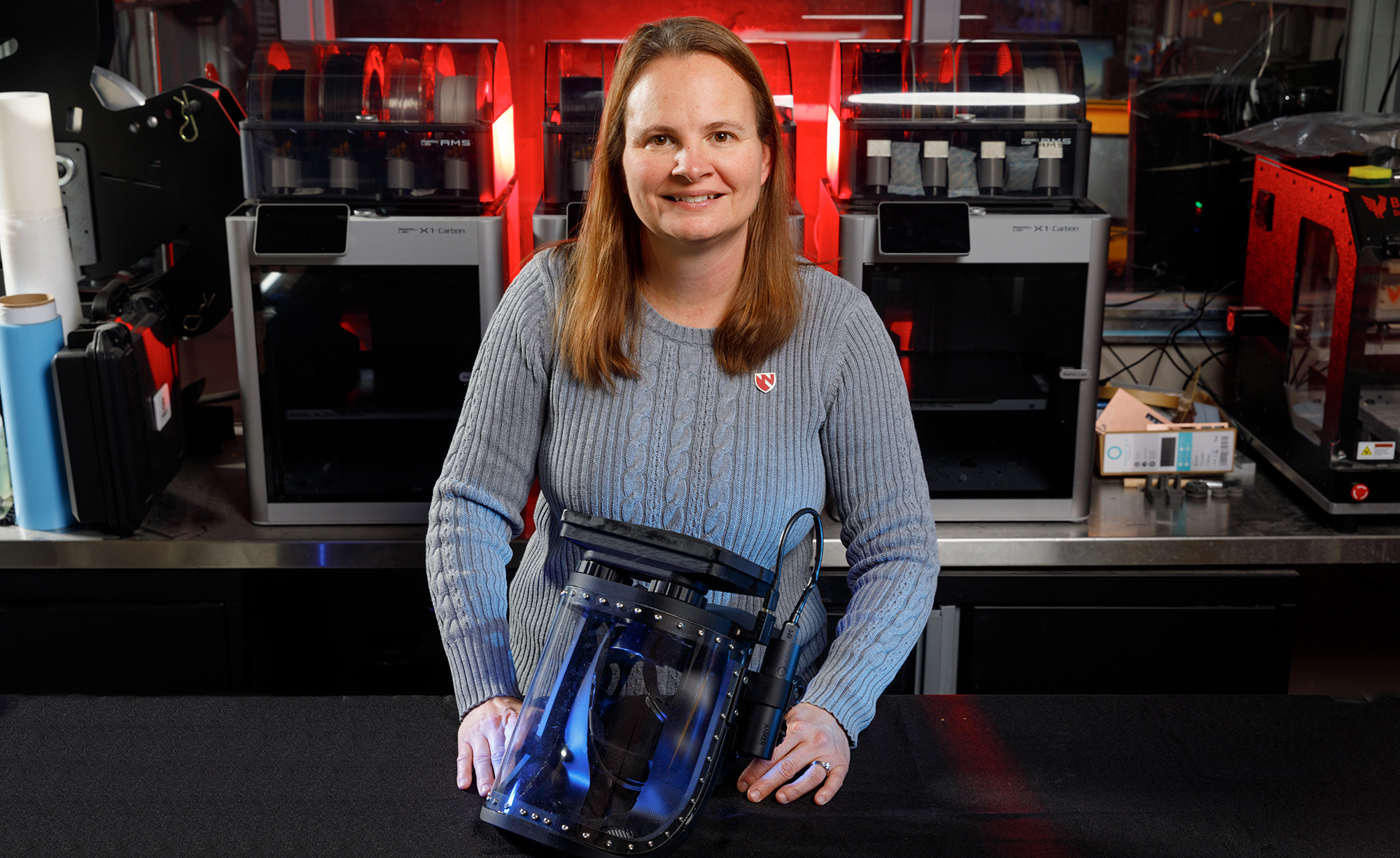 Dr. Elizabeth Beam, NSRI Fellow and assistant professor at UNMC, with one of her latest projects — the Beam Helmet