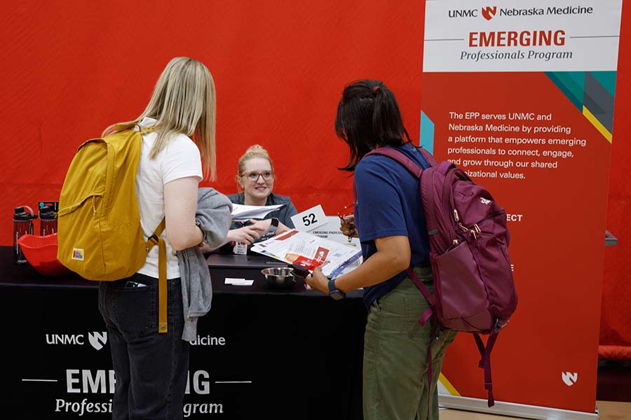 A representative of the Emerging Professionals Program, one of UNMC's employee resource groups, provides information. 