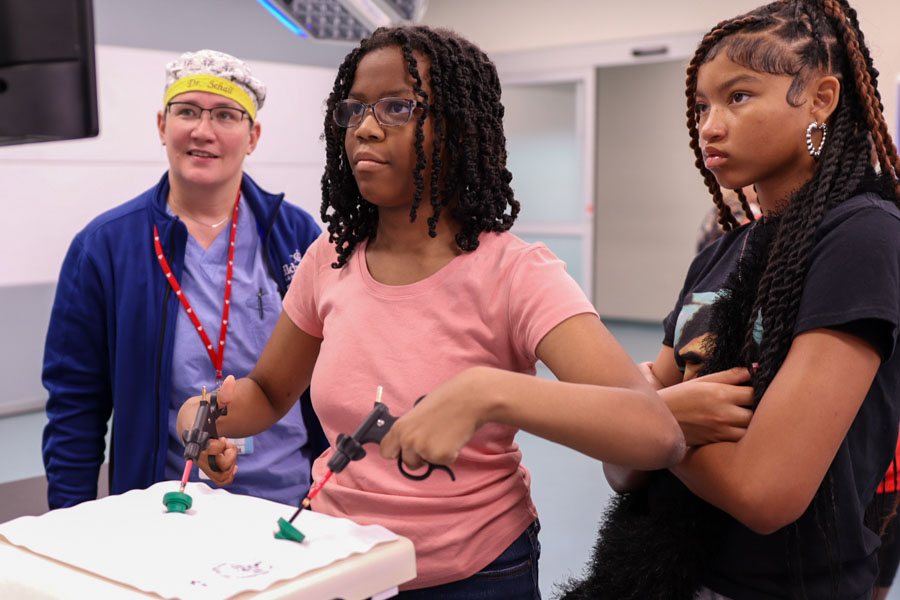 Students visiting UNMC for the Department of Pediatrics and the Child Health Research Institute's Community Partner Career Day could experiment with laparoscopic training equipment.