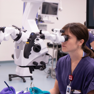 surgeon using microscope