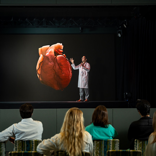 Cardiovascular medicine faculty member teaching in the iExcel holographic theater.