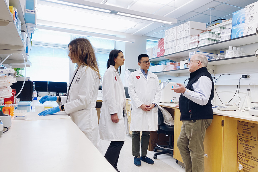 Dr. Peter Mannon in his research lab with UNMC gastroenterology fellows.