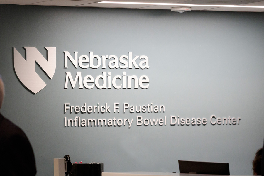 A photo of the wall behind the Frederick F. Paustian Inflammatory Bowel Disease Center, depicting its name