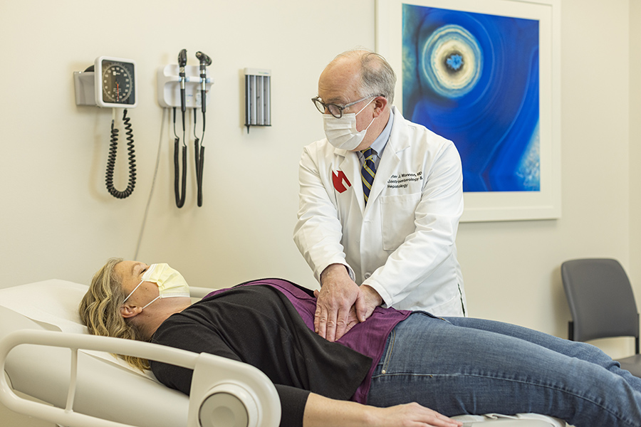 Dr. Peter Mannon with a patient in the IBD Center at UNMC.