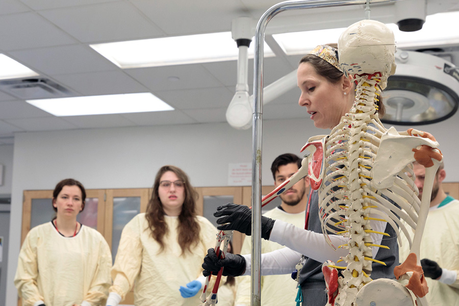 A UNMC Division of Rheumatology faculty member teaches a group of trainees.