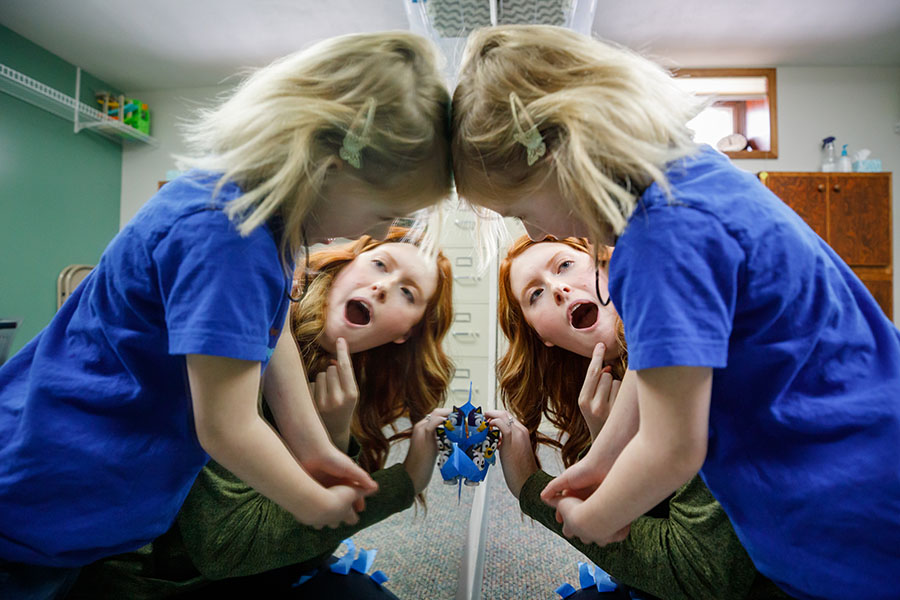 A speech-language pathologist points to her mouth making an ‘Ahh’ sound during a therapy session with a young client at the RiteCare Clinic Hastings | MMI.