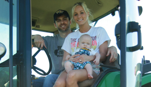 Wes Whitten, M.D., with wife Kari and son Winston, sticks to his roots.