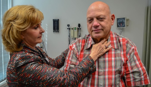 Julie Vose, M.D., examines Randy Whisnant
during one of his frequent trips from North
Carolina to Nebraska.