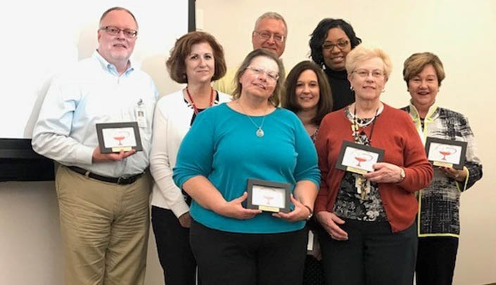 The Distinguished Team Award was received by the Centennial Planning Committee. Team members included (left to right) John Schleicher, Vicky Cerino, LaDonna Tworek, John Barrier, Lisa Muschall, Deidra Sheppard-Calloway, Audrey Nelson, Ph.D., and Juliann Sebastian, Ph.D.