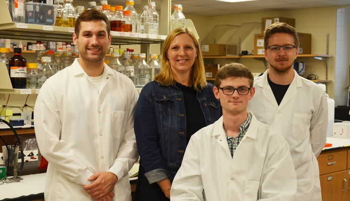 Julie Soukup, Ph.D., with three of her undergraduate research students.