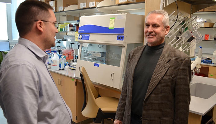 Sen. Murman, right, speaks with Nicholas Woods, Ph.D.