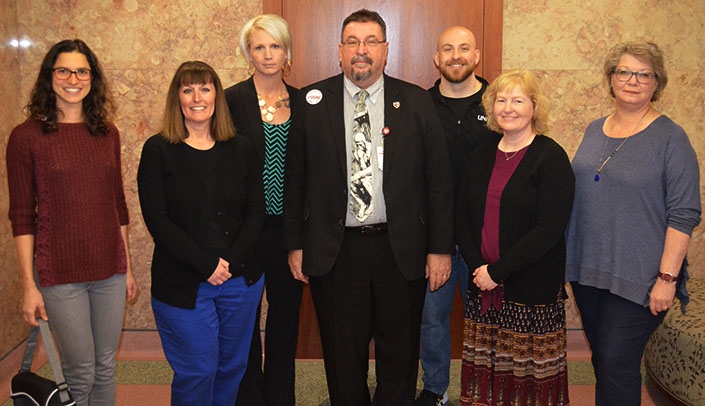 From left to right, February Standout Luana Taquette Dalvi, March Standouts Becky Zessin and April Robinson, MMI Director Karoly Mirnics, M.D., Ph.D., and March Standouts Chad Bertagni, Candi Koenig and Kellie Ellerbusch.