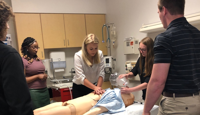 Reacting to a simulated cardiac arrest are, from left, Tobi Lawani, Emily Hand, Madison Coulter and Jarred Glinn.