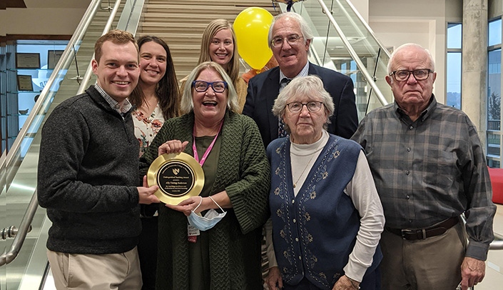 Ally Dering-Anderson, third from left, with family and friends after receiving the 2021 College of Pharmacy Distinguished Teaching Award.