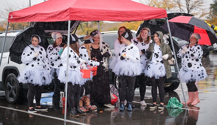 A team of Dalmatians waits for trick-or-treaters at the event.