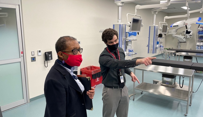 Omaha City Council member Juanita Johnson tours the Davis Global Center with Michael Hollins, director of community and business engagement with iEXCEL.