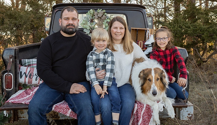 Tamra Nielson with her family -- husband Isaiah, son Zandyr and daughter, Emersyn -- as well as their dog, Garth, who (you can tell just by looking at him) clearly believes he is a cat.