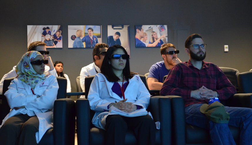students watching screen with glasses