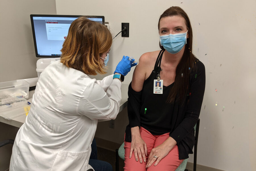 Confetti flew as Operation Immunization delivered its 15&comma;000th flu vaccine since the UNMC College of Pharmacy project began in 2017&period; Madalynne Stubbendick&comma; P3&comma; administered the shot to Amber Hawk&comma; pharmacy&apos;s admissions and recruitment director&period;