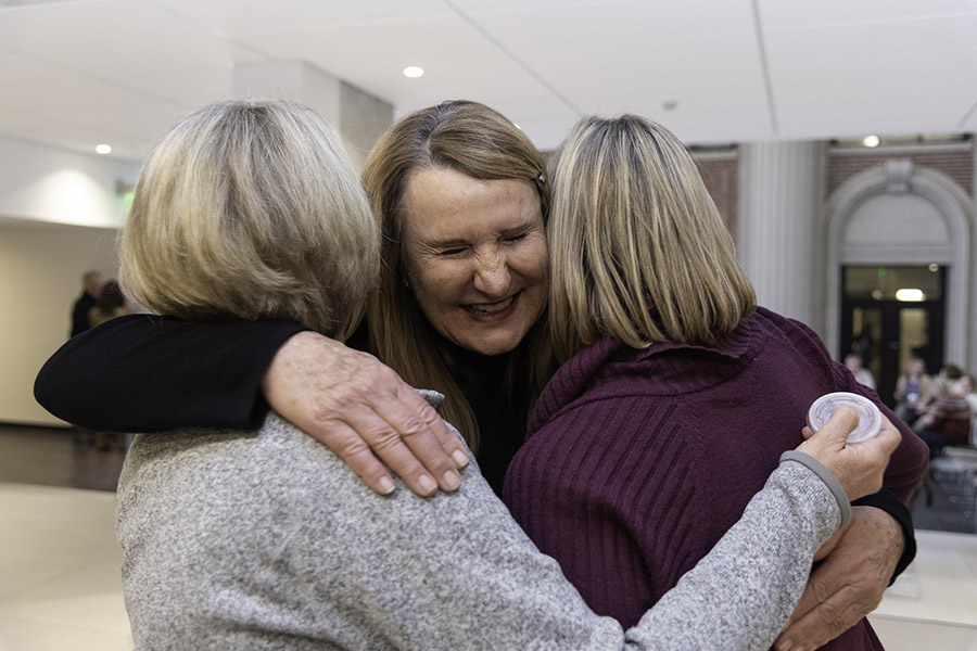 Vicki Hamm greets two of the many friends who came out on Dec&period; 13 to wish her well&period;