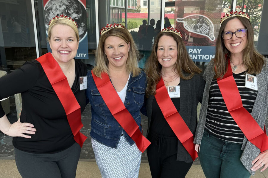 Libby Mollard&comma; PhD&comma; Michele Balas&comma; PhD&comma; Windy Alonso&comma; PhD and Heidi Keeler&comma; UNMC&comma; from left&comma; donned tiaras and sashes at the UNMC College of Nursing Faculty and Staff Annual Meeting in recognition of each obtaining a National Institute of Health or Health Resources and Services Administration research grant for the first time in their careers&period;