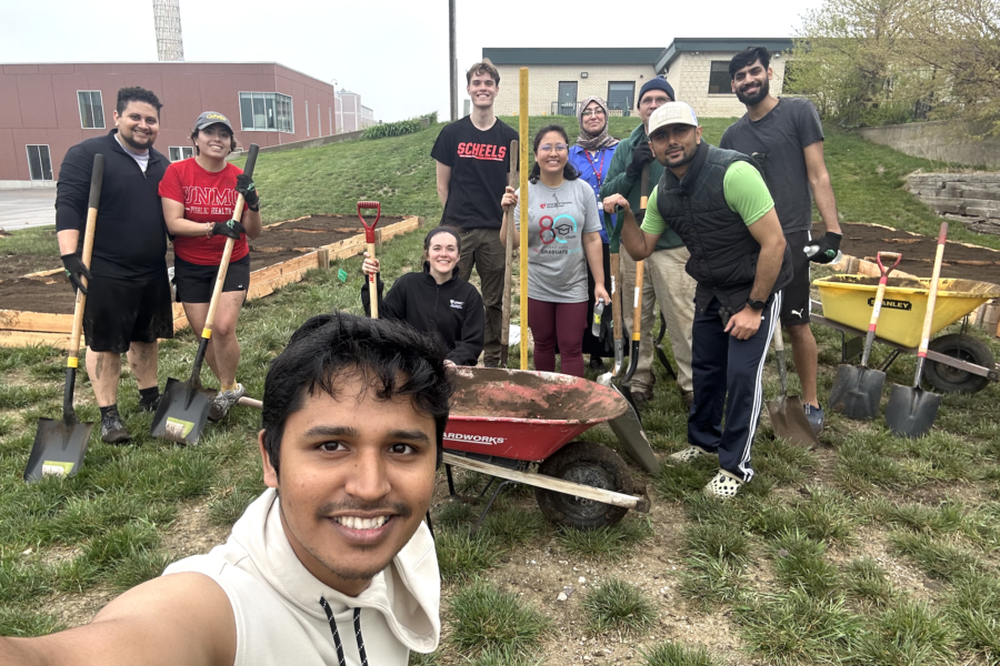 Volunteers&comma; which include students&comma; faculty and staff of the UNMC College of Public Health&comma; College of Medicine&comma; and Office of Graduate Studies&comma; pause to take a photo while preparing 10 garden boxes for planting on May 6&comma; 2023&period;
