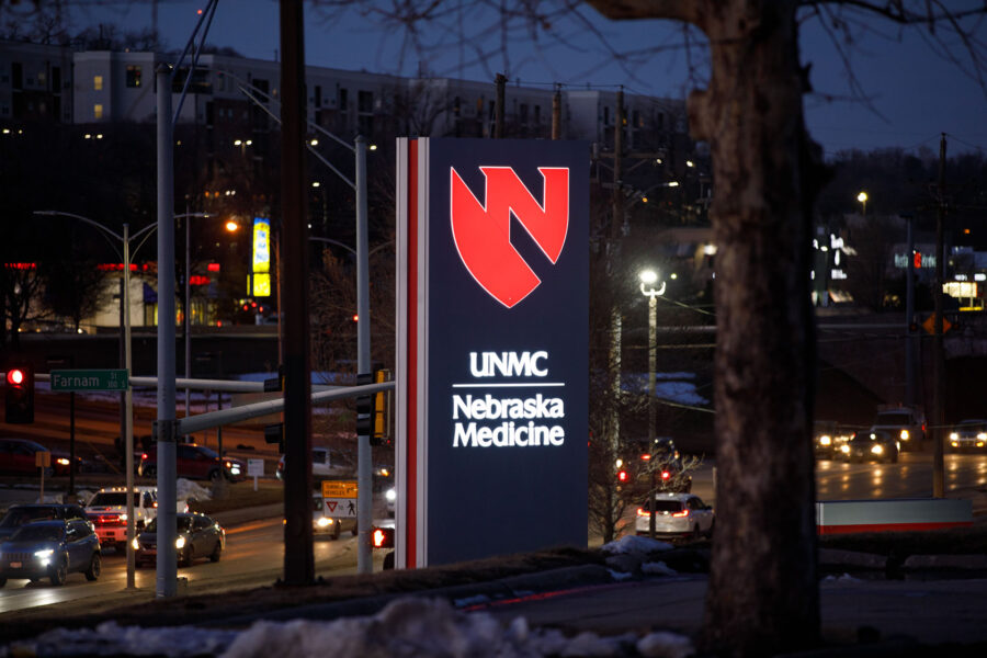UNMC&sol;Nebraska Medicine signage overlooking the intersection of Farnam Street and Saddle Creek Road on the west side of campus&period;