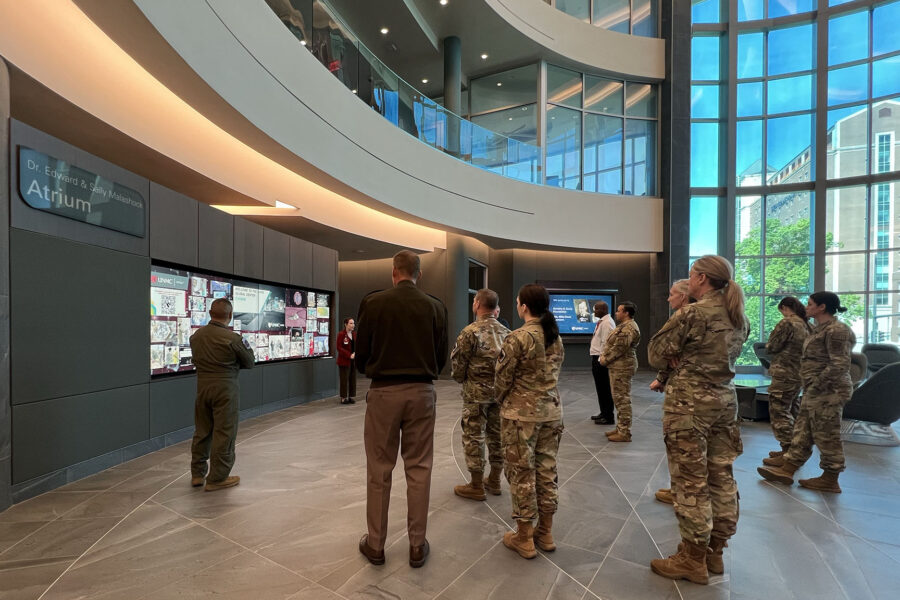 Moriah McCune&comma; community engagement coordinator&comma; iEXCEL&comma; explains the iEXCEL simulation program to visiting members of the National Guard Bureau and the Nebraska National Guard&period;