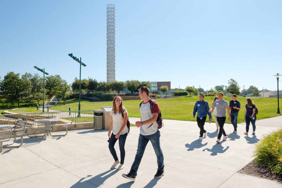 Students walking across the Ruth and Bill Scott Student Plaza