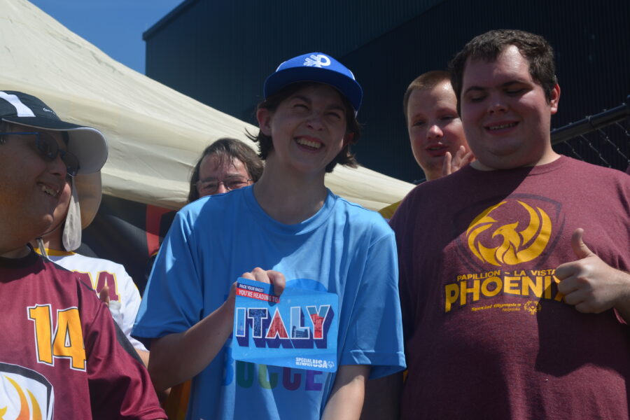 Rachel Mulligan holds up a postcard that invited her to the Special Olympics Winter Games in Italy in 2025&period;