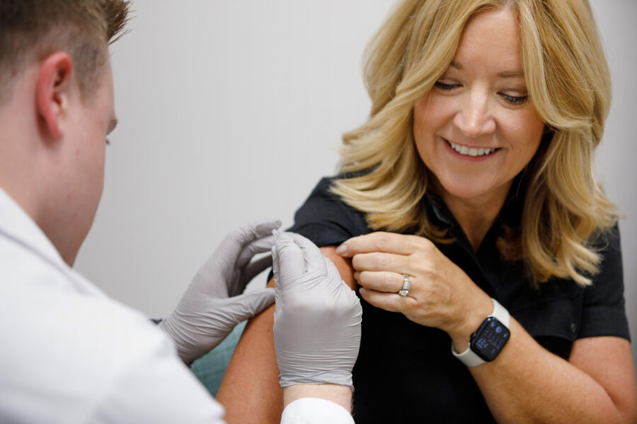 UNMC pharmacy students administered flu vaccinations to the campus community as the UNMC College of Pharmacy&apos;s Operation Immunization began on Monday&comma; Sept&period; 9&period; Here&comma; pharmacy student Samuel Schendt gives a flu shot to Tanya Custer&comma; an associate professor in the UNMC College of Allied Health Professions and distance education director in the UNMC Department of Allied Health Professions Education&comma; Research and Practice&period;