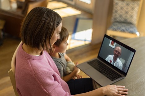 A woman and child at a video visit