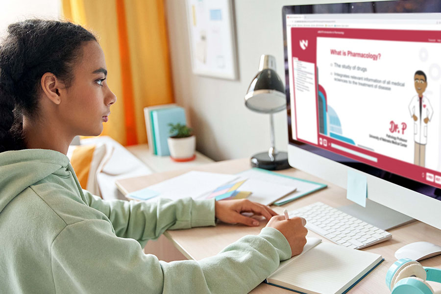 A student working at a computer on a uBEATS module