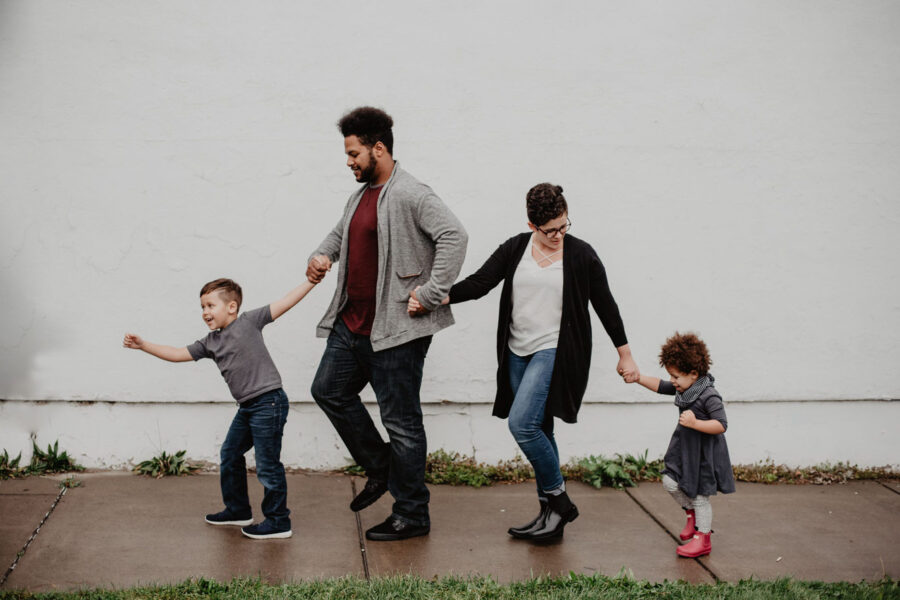 A family walking along the sidewalk