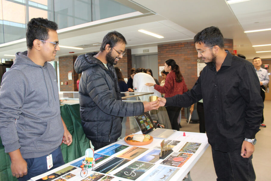 Students visiting an informational table