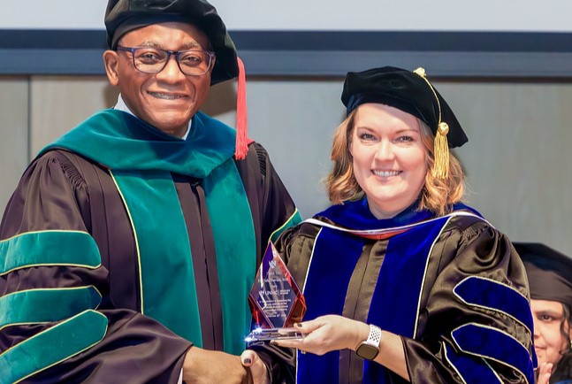 UNMC Interim Chancellor Dele Davies&comma; MD&comma; with Kendra Schmid&comma; PhD&comma; interim dean for UNMC Graduate Studies&period;