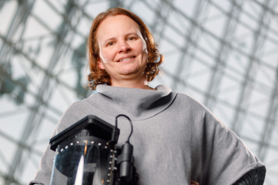 Dr. Beam, with her prototype for a refined air purifying helmet to protect health care workers