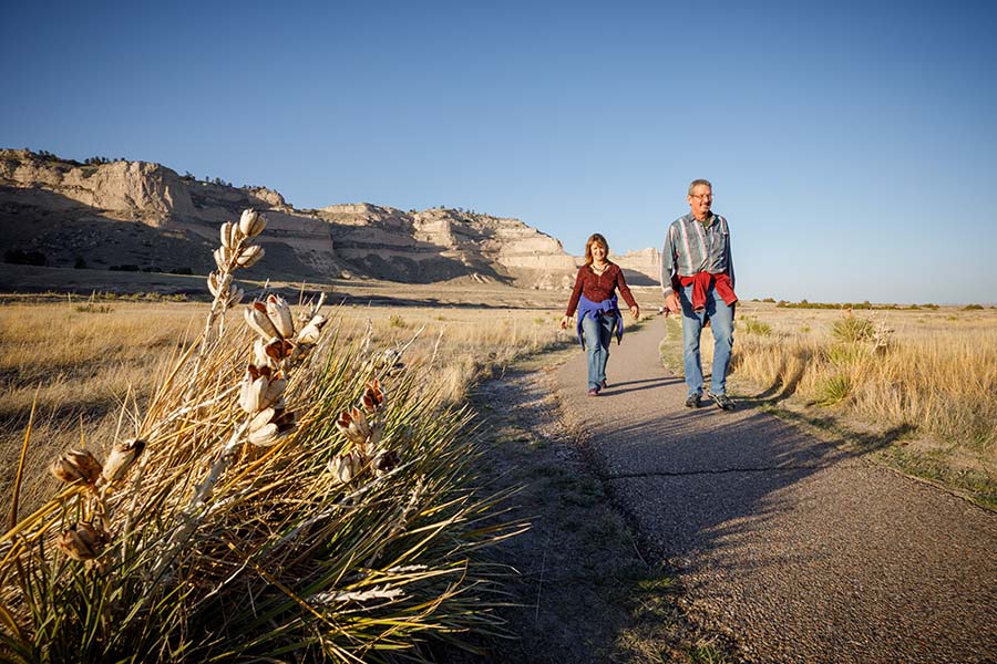 Two people walking on a path in western Nebraska.