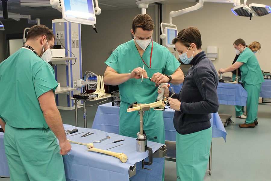 Orthopaedic surgery residents practicing surgical skills