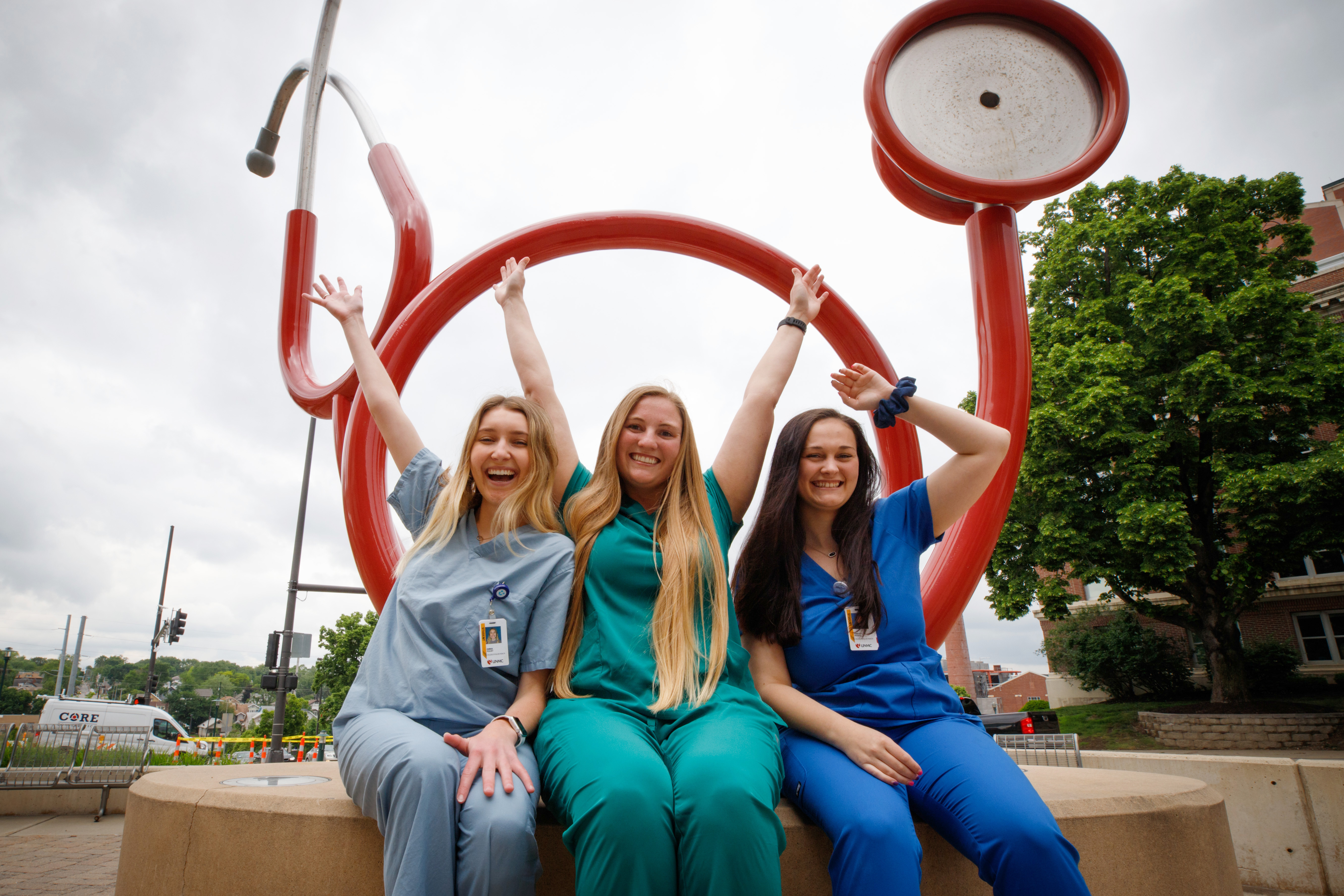 Students in front of sculpture