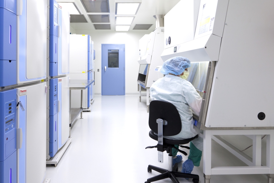 Technician seated at machine