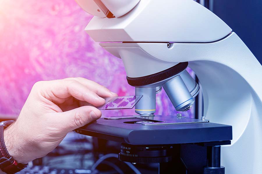 Microscope and slide in a lab