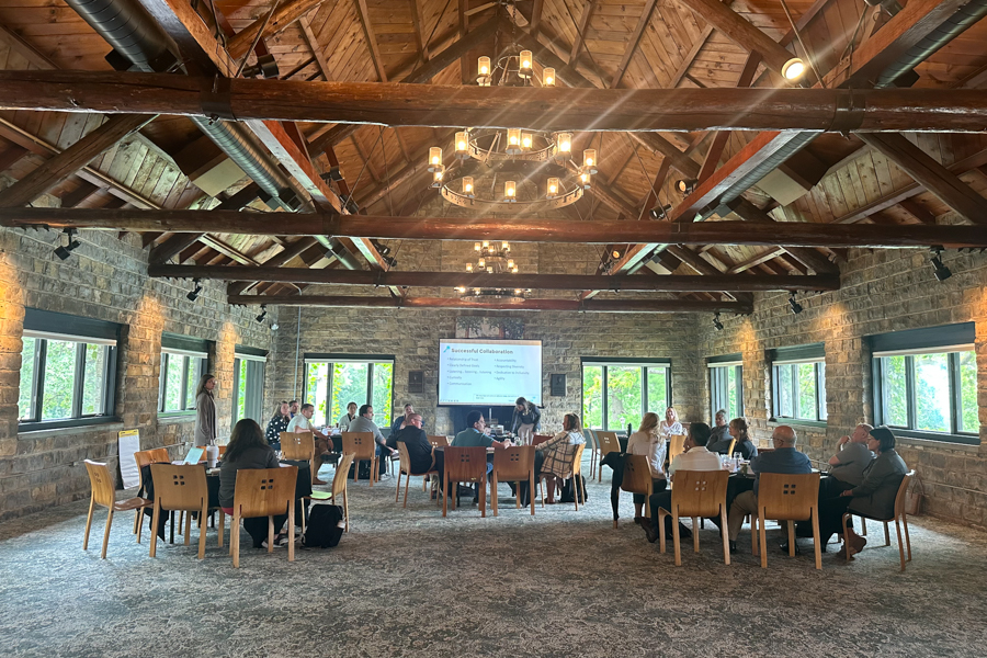 photo of leaders meeting in a lodge