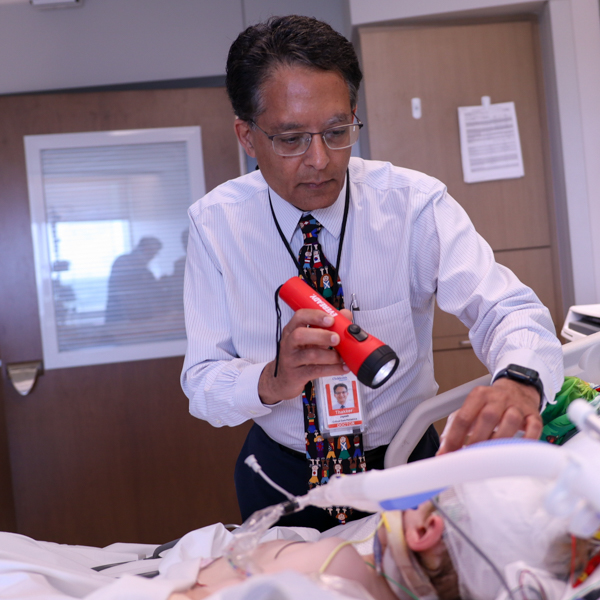 doctor examining patient with flash light